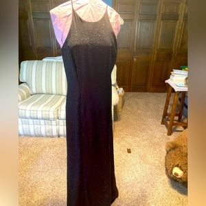 Floor-length gown with red underskirt and black beaded overlay